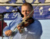 Greg Moore on fiddle with Remington Ryde - photo by Steven Simpson
