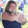 Sally Berry snuggles with a new fan at the Gettysburg Bluegrass Festival (August 2016) - photo by David Morris