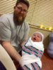 Nathan Livers holds his son, Aden, in the hospital