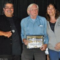 Bob Jeannin accepts her Dedication Award from Ernie and Debi Evans at the 2017 Yee Haw Music Festival - photo © Bill Warren