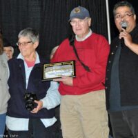 Ted and Irene Lehmann accepts their Dedication Award from Debi and Ernie Evans at the 2017 Yee Haw Music Festival - photo © Bill Warren