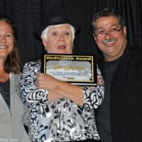 Jo Odom accepts her Dedication Award from Debi and Ernie Evans at the 2017 Yee Haw Music Festival - photo © Bill Warren