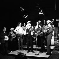 Dub Crouch, far left with banjo peghead covering his face while John Hartford and Bob Wagganer twin fiddle.
