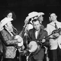 PBS taping circa 1972. Dub Crouch and Herman Beck on banjos. Don Brown, Stan Waggoner, and Norman Ford visible in background. The event called in John Hartford, Dub Crouch - Norman Ford and The Bluegrass Rounders, And Don Brown and The Ozark Mountain Trio.
