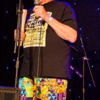 Bill Knowlton, MC, known partly for his fantastic pants at Joe Val Bluegrass Festival (2/18/17) - photo © Tara Linhardt