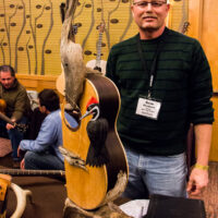 Dave Boulware of Bent Twigg guitars made some eyecatching display art as well as whole ones that play nice at Wintergrass 2017 - photo © Tara Linhardt