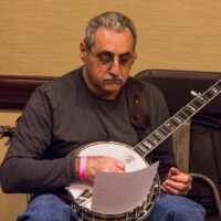 Studious banjo picker attending the banjo workshop at the 2017 Joe Val Bluegrass Festival - photo © Tara Linhardt
