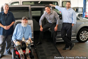 Dennis Jones with the staff at Ilderton Conversions, and his new Chrysler minni-van, equipped with special mobility devices and hand controls
