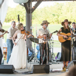 Laura Orshaw and Tony Watt sit in with the Caleb Klauder Country Band following their wedding ceremony (June 10, 2017) - photo by Adam Frehm