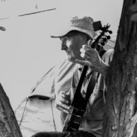 Banjo picker in Stickerville campground at Weiser 2017 - photo © Tara Linhardt