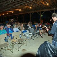 The music continues without amplification after a thunderstorm sht down the sound system at the 2017 Charlotte Bluegrass Festival - photo © Bill Warren