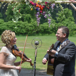 Laura Orshaw and Tony Watt sing Magnolia Wind to each other during their wedding ceremony (June 10, 2017) - photo by Adam Frehm