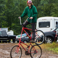 Jeffrey Phelps riding his homemade bicyle in campground at Grey Fox 2017 - photo © Tara Linhardt