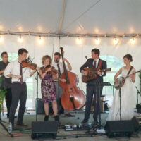 Margaret MacKay and Michael Reese, perform with Chasing Blue at their wedding reception July 22, 2017