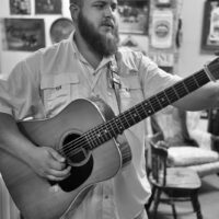 Kyle Leapard with The Dave Adkins Band warms up backstage at Pickin' In Parson 2017 - photo by Jeromie Stephens