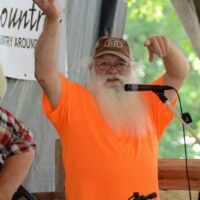 MC Jerry Eicher auctioning pies at the 2017 Blissfield Bluegrass on the River 2017 - photo © Bill Warren