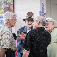 Tom Gray, Carl Padger, and Bill Knwolton chat during the2017 IBMA World Of Bluegrass in Raleigh - photo by Frank Baker