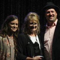 Carolina In The Fall accepts their Momentum Award during World of Bluegrass - photo by Frank Baker
