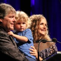 Hosts Béla Fleck and Abigail Washburn with their son, Juno, at the 2017 IBMA Awards - photo by Frank Baker