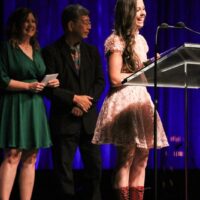 Sierra Hull accepts her Mandolin Player of the Year award at the 2017 IBMA Awards - photo by Frank Baker
