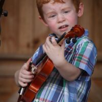 Bodie Frankhouser with Remington Ryde at the August 2017 Gettysburg Bluegrass Festival - photo by Frank Baker