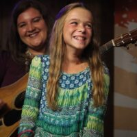 12 year old Faith sings with Rhonda Vincent & The Rage at the August 2017 Gettysburg Bluegrass Festival - photo by Frank Baker