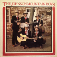 Dudley with The Johnson Mountain Boys, holding his D-35 Martin before its destruction