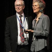 John Lawless and Penny Parsons accepting the 2017 Print/Media Person of the Year Award from the IBMA - photo by Frank Baker