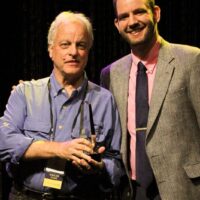 Bill Nowlinand Daniel Mullins accepting the 2017 Best Liner Notes of the Year Award from the IBMA - photo by Frank Baker