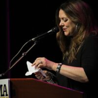 Donna Ulisse presenting the 2017 Songwriter of the Year Award from the IBMA - photo by Frank Baker