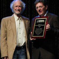 Scott O'Malley with Tim O'Brien accepting Norman Blake's 2017 Distinguished Achievement Award from the IBMA - photo by Frank Baker