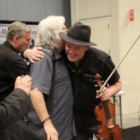 Ricky Skaggs and Mark O'Connor in the Exhibit hall at the 2017 IBMA Wide Open Bluegrass festival - photo by Frank Baker