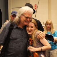 Ricky Skaggs and Maggie O'Connor in the Exhibit hall at the 2017 IBMA Wide Open Bluegrass festival - photo by Frank Baker