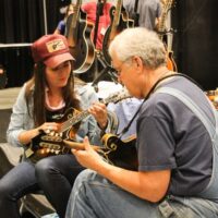 Jenni Lyn Gardner and Tony Williamson jamming in the Exhibit hall at the 2017 IBMA Wide Open Bluegrass festival - photo by Frank Baker