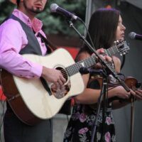 Buddy and Charli Robertson with Flatt Lonesome at the 2017 Wide Open Bluegrass festival - photo by Frank Baker