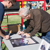 Eric Uglum signing a CD at Logandale Fall Festival- photo by Debby Clickenbeard