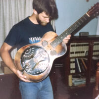 Paul Beard with Mike Auldridge's Dobro Model 37 (serial #401) which he had in for repairs in 1986