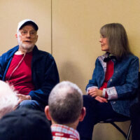 Eddie and Martha Adcock with Tom Gray telling stories at the 2018 Joe Val Bluegrass Festival - photo © Tara Linhardt