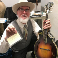 Mark Hargis with Monroe's mandolin at the Bill Monroe Museum benefit, January 27, 2018