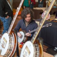 Checking out banjos at the 2018 DC Bluegrass Festival - photo by Jeromie Stephens