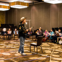 Joe Craven leads the large group at Youth Academy at Wintergrass 2018 - photo © Tara Linhardt