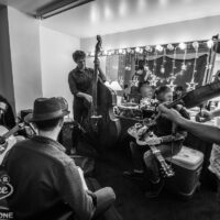 Infamous Stringdusters warm up backstage at the 2018 Bender Jamboree - photo © Paul Citone