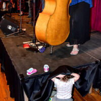 Mia Magnolia checks under the stage at The Allegheny Drifters 15th Anniversary concert (April 14, 2018)