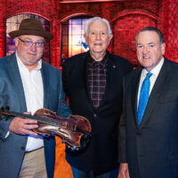 Rick Dollar with the Roy Acuff fiddle, Lamar Peek and Mike Huckabee at Trinity Broadcasting Network - photo courtesy of TBN