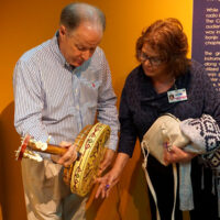 Johnny Baier and Pamm Tucker examine Earl Scruggs' Vega Deluxe at the American Banjo Museum in Oklahoma City (April 2018)