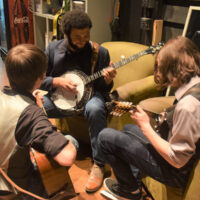 Cane Mill Road warms up backstage at Bluegrass & BBQ - photo by Martha Bohner