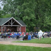 Beating the rain at the May 2018 Gettysburg Bluegrass Festival - photo by Frank Baker