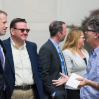 Paul Schiminger and Joe Mullins speak with David Menconi with the News and Observer at the Raleigh Convention Center (May 31, 2018) - photo by Scott Peacock (Visit Raleigh)