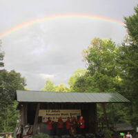 Rainbow over David Parmley at the 2018 Lil John's Mountain Music Festival - photo by Laura Tate Photography