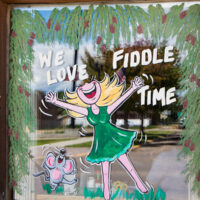 Local restaurant window painted for the 2018 National Oldtime Fiddlers Contest - photo © Tara Linhardt